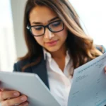 Completing the eta application uk on a digital device in a modern office setting.